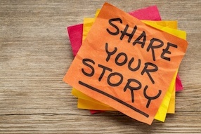 Post-it note saying 'share your story'